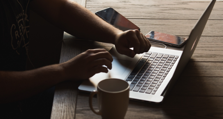 person working on laptop at desk